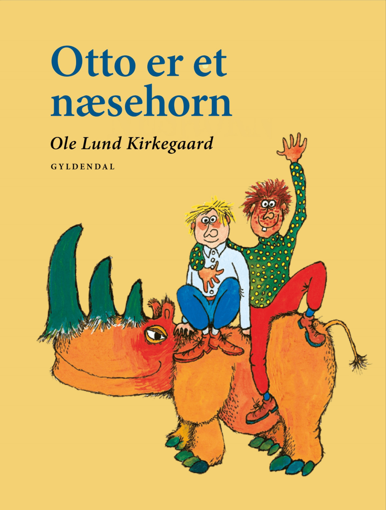 Cover illustration of the book 'Otto er et næsehorn' by Ole Lund Kirkegaard, featuring two characters riding on a colorful rhinoceros.
